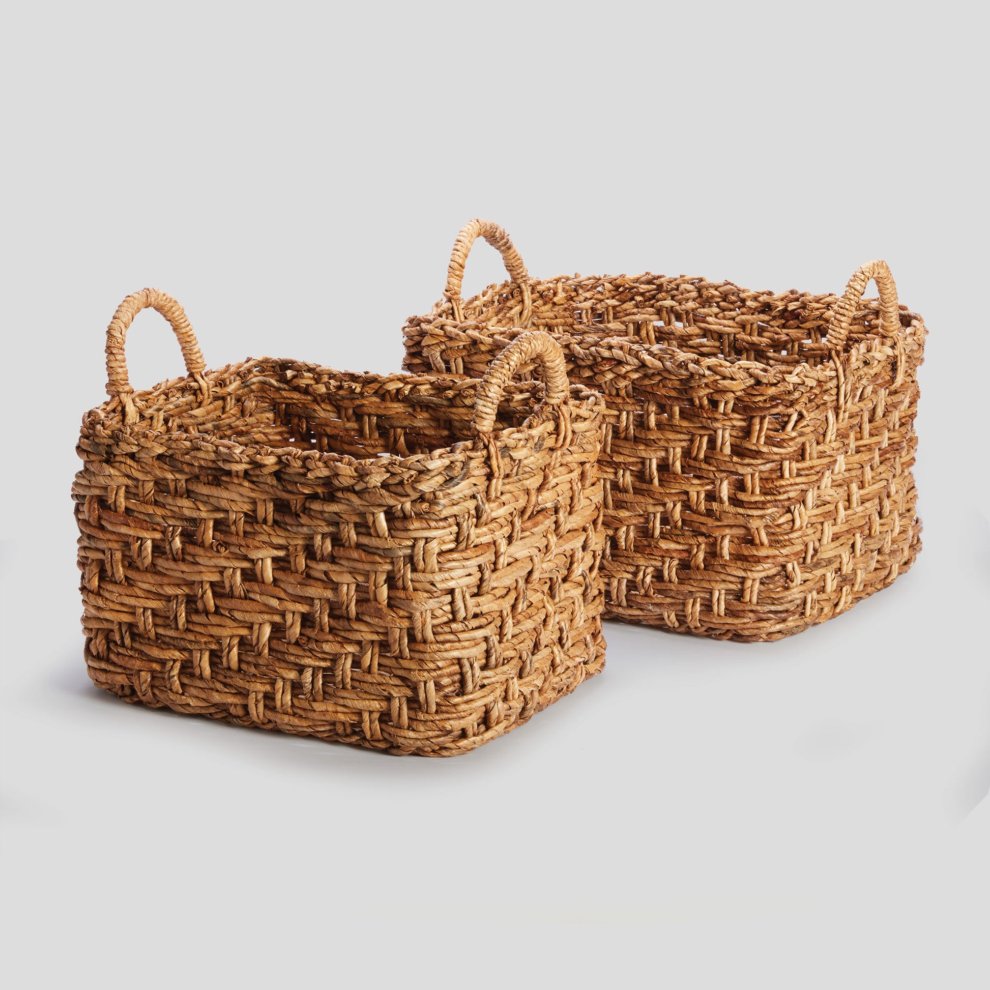 Large woven banana leaf baskets with handles (set of 2) - stylish home accent (Image1).