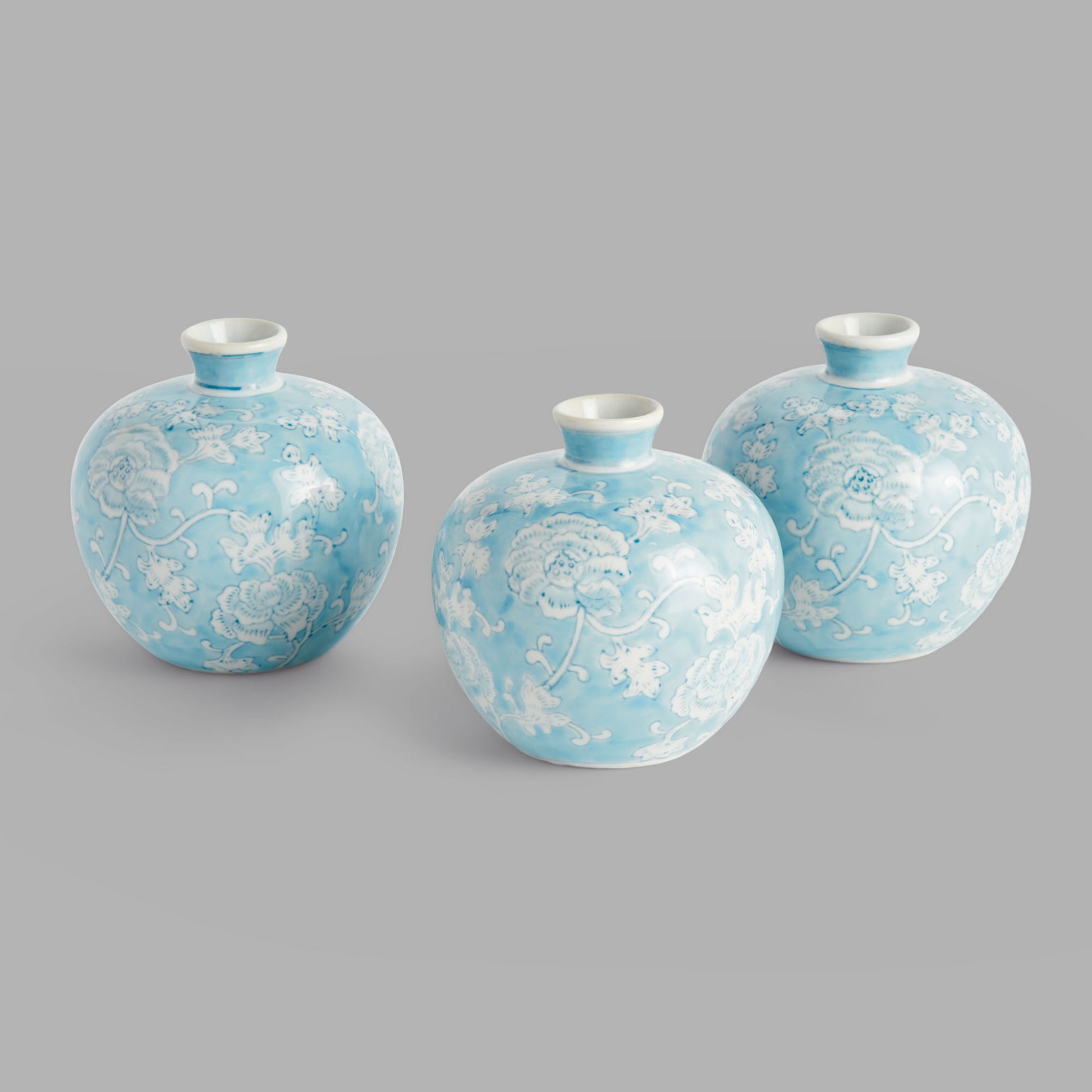 Light blue hand-painted porcelain bud vases (set of 3) - stylish home accent (Image1).