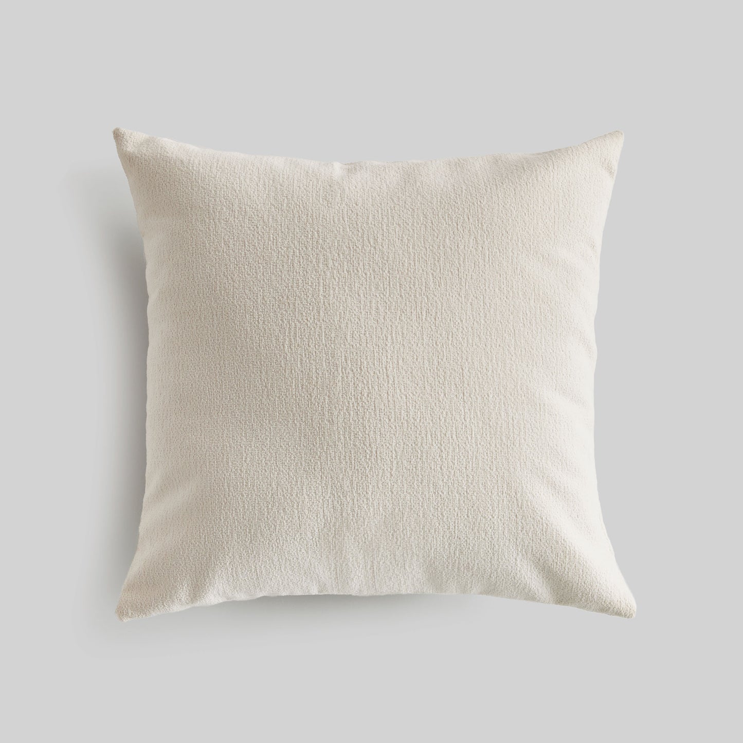 Light cream jacquard square pillow for home decor and accessories.