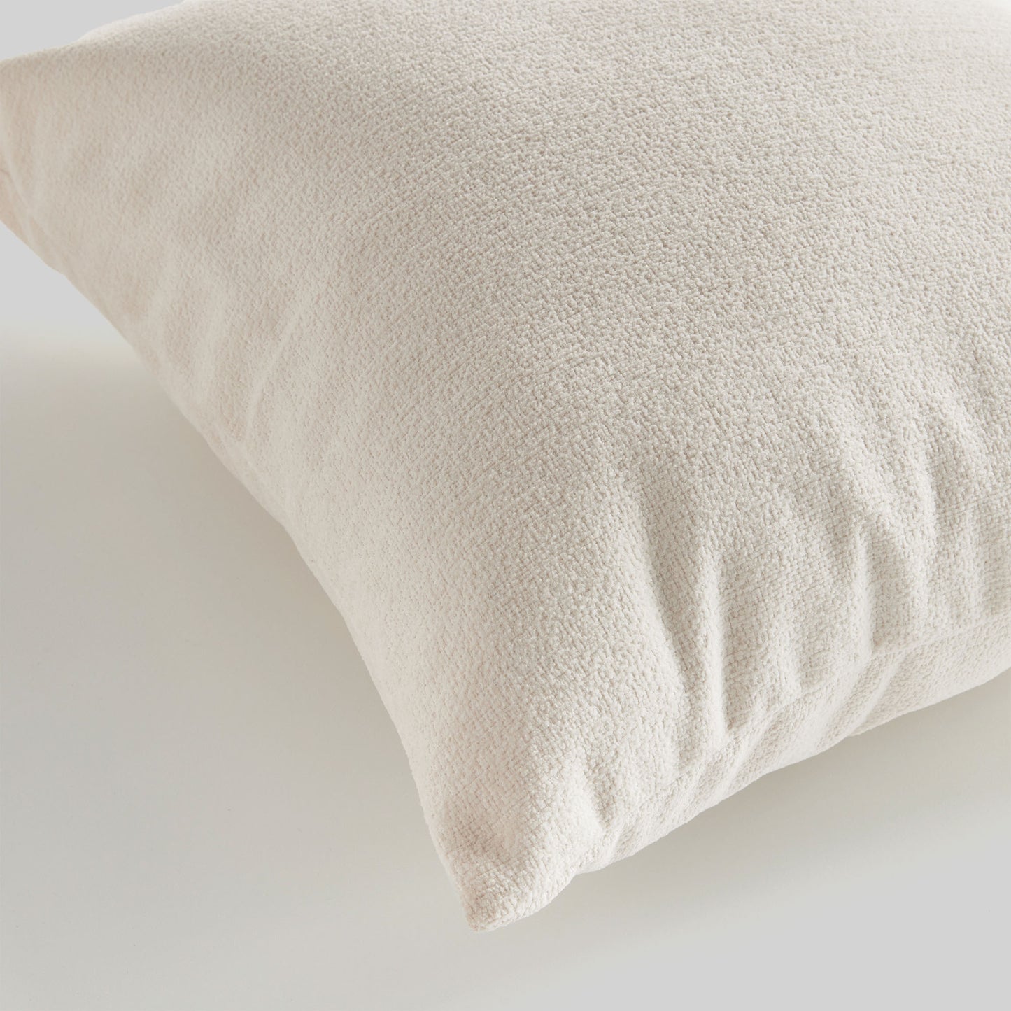 Light cream jacquard square pillow for home decor and accessories.