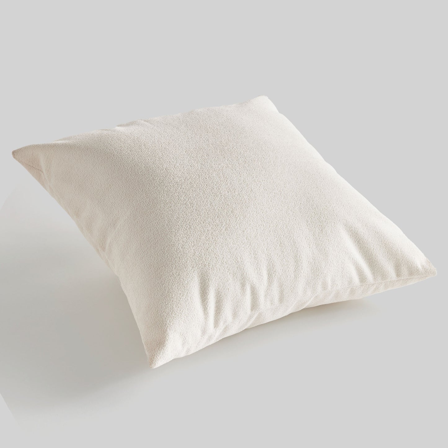 Light cream jacquard square pillow for home decor and accessories.