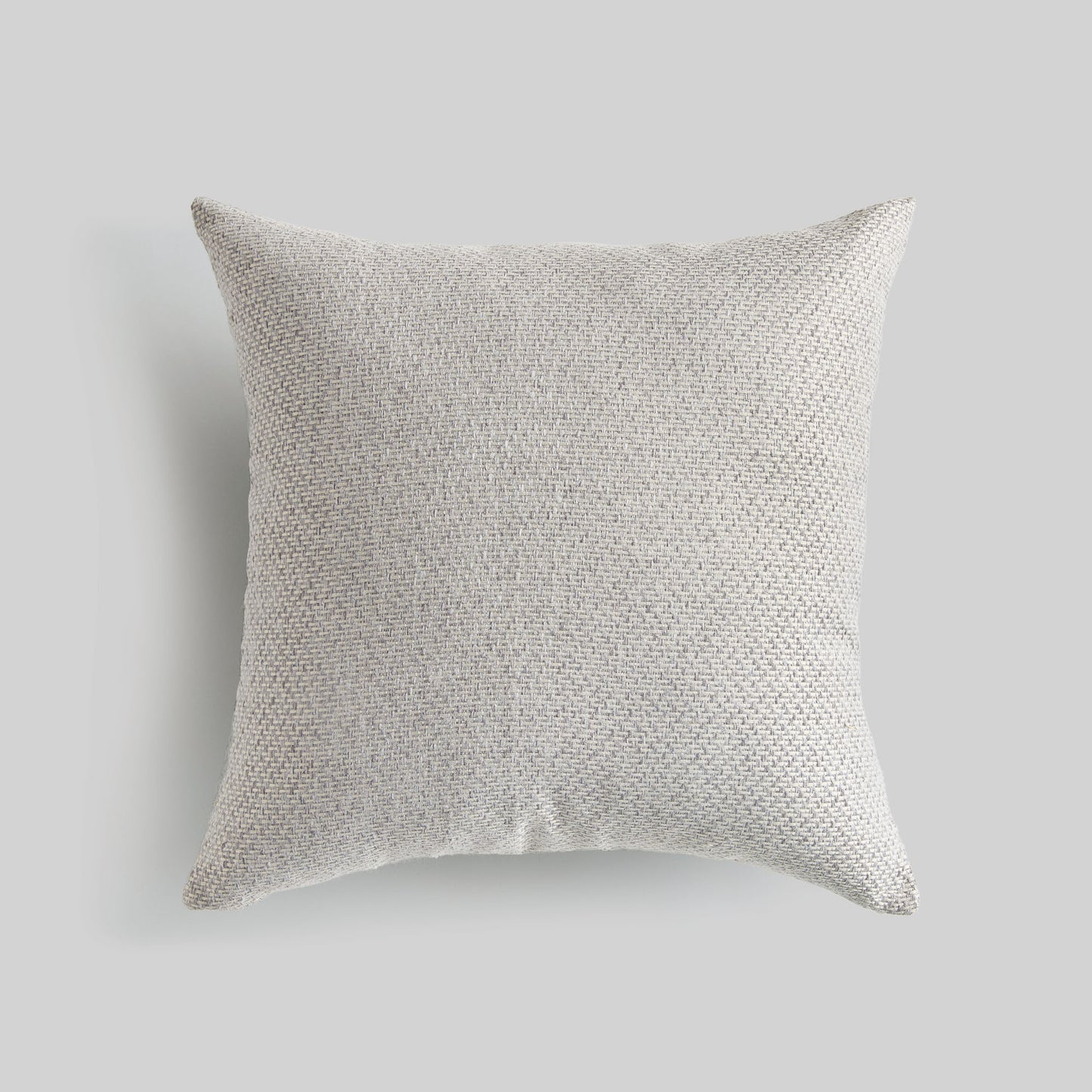 Light gray jacquard woven pillow for home decor and accessories.