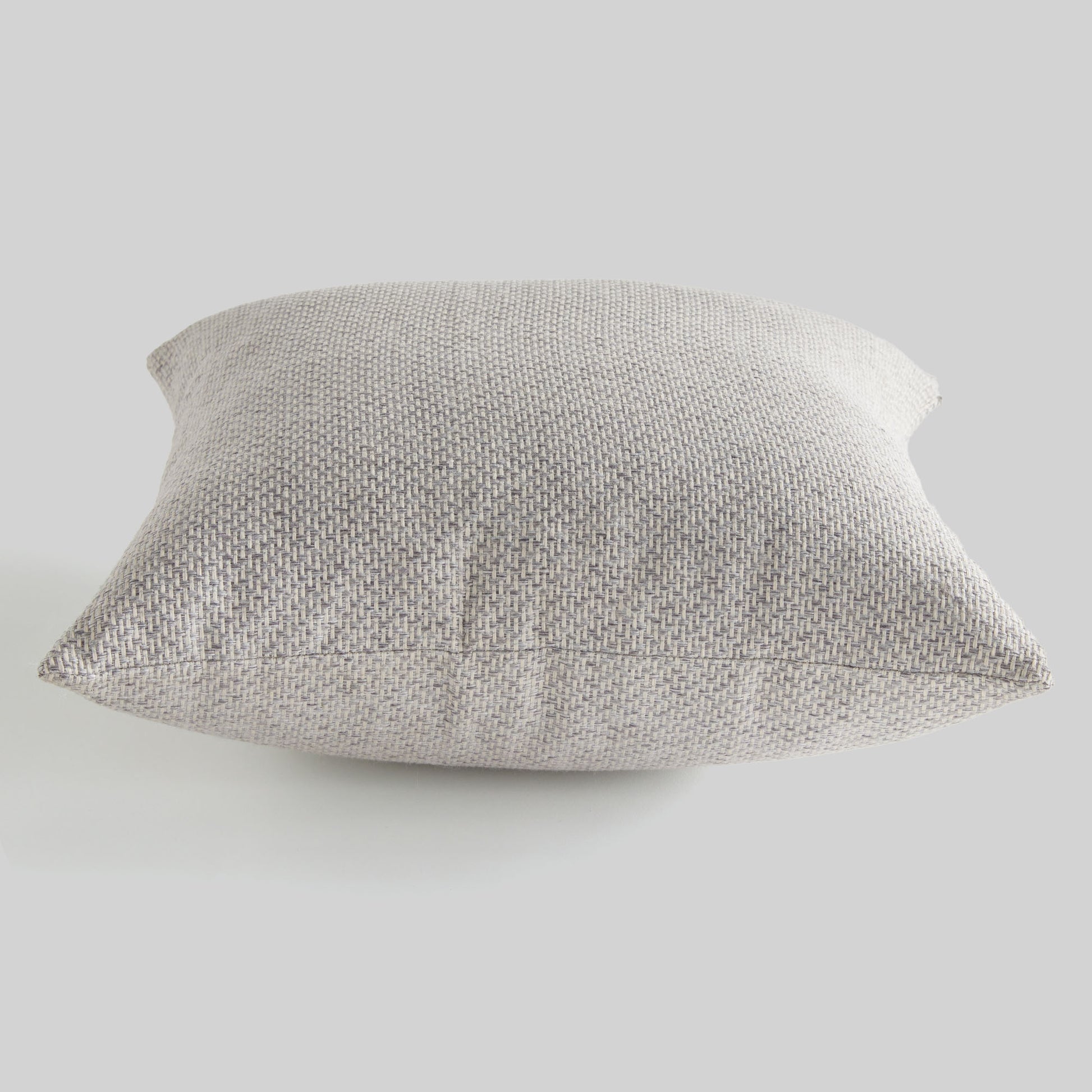 Light gray jacquard woven pillow for home decor and accessories.