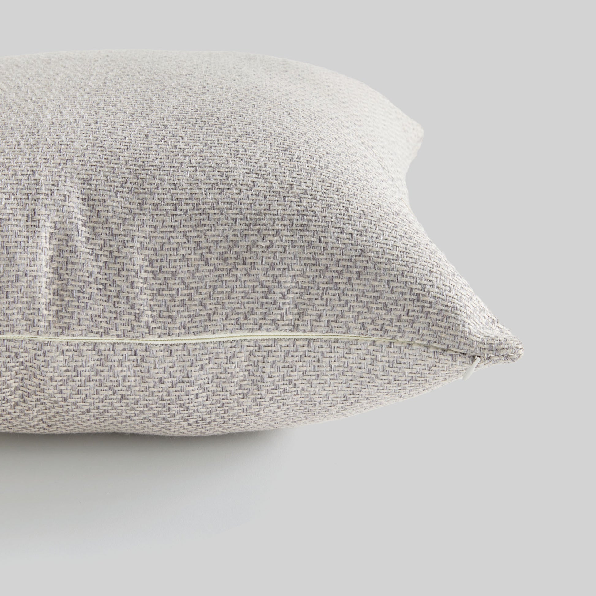 Light gray jacquard woven pillow for home decor and accessories.