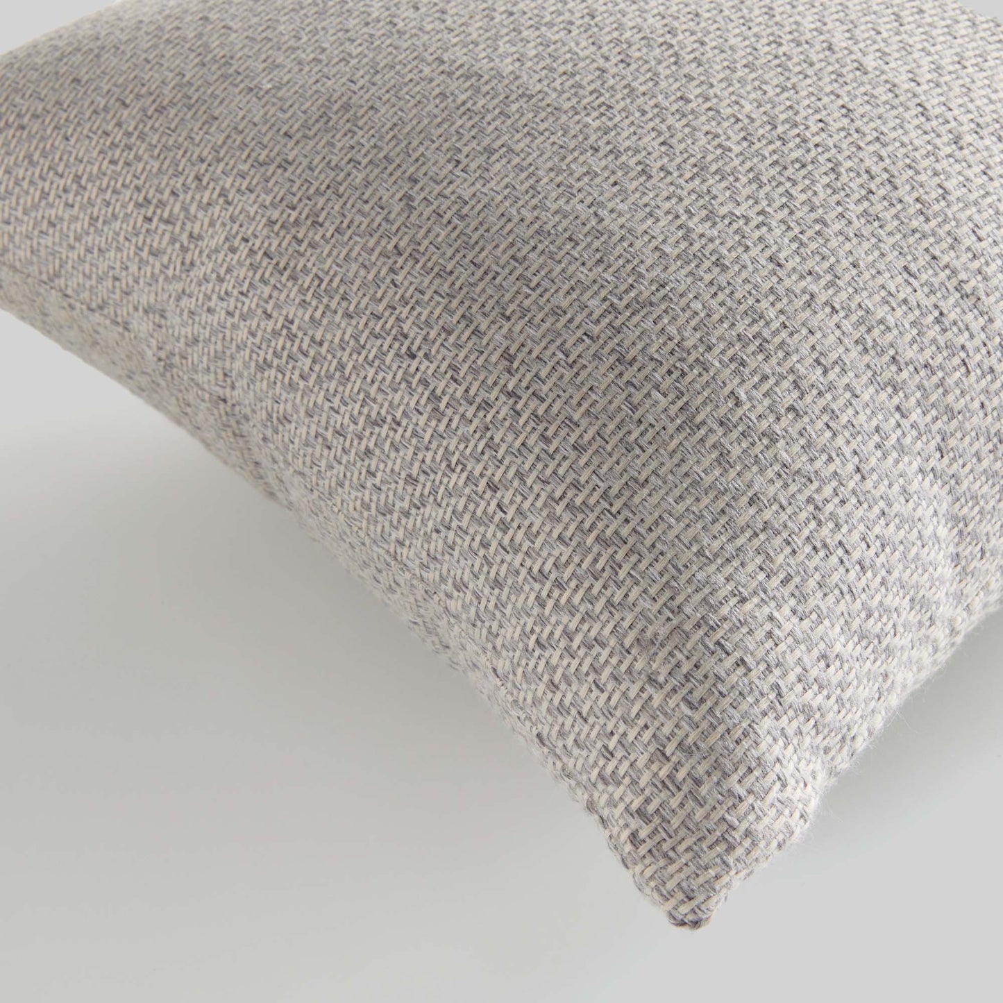 Light gray jacquard woven pillow for home decor and accessories.