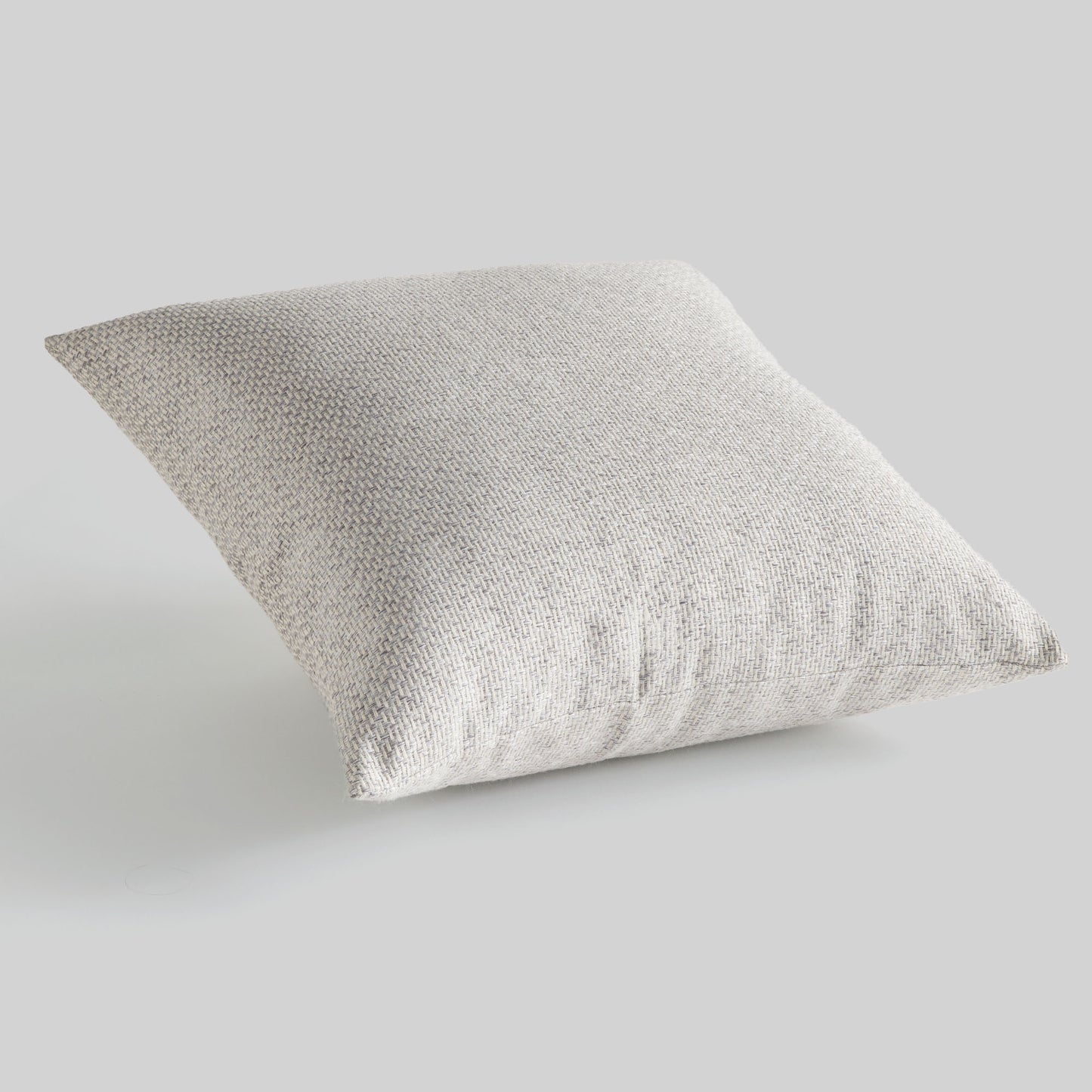 Light gray jacquard woven pillow for home decor and accessories.