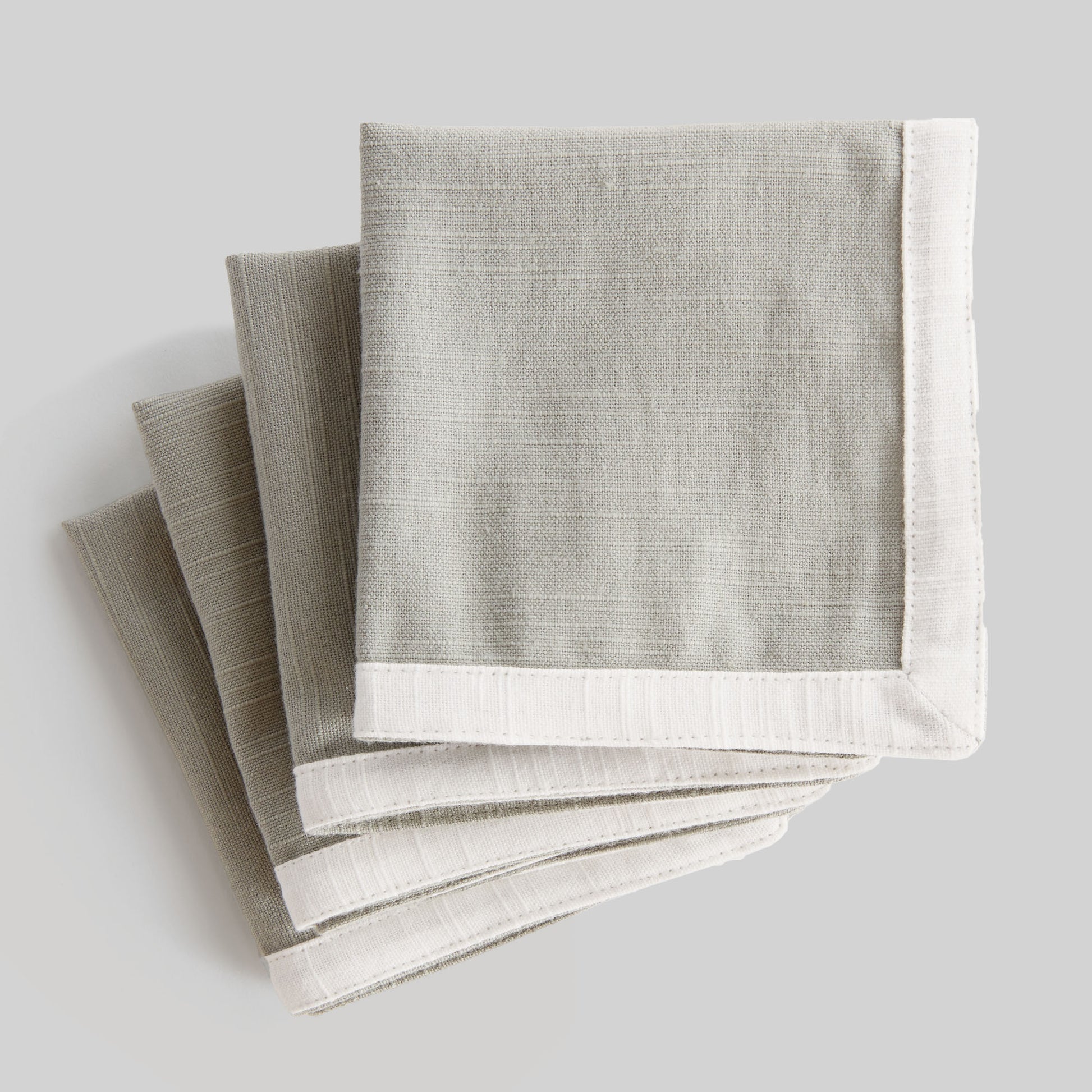 Light green with white border cotton cocktail napkins (set of 4) - stylish home accent (Image1).