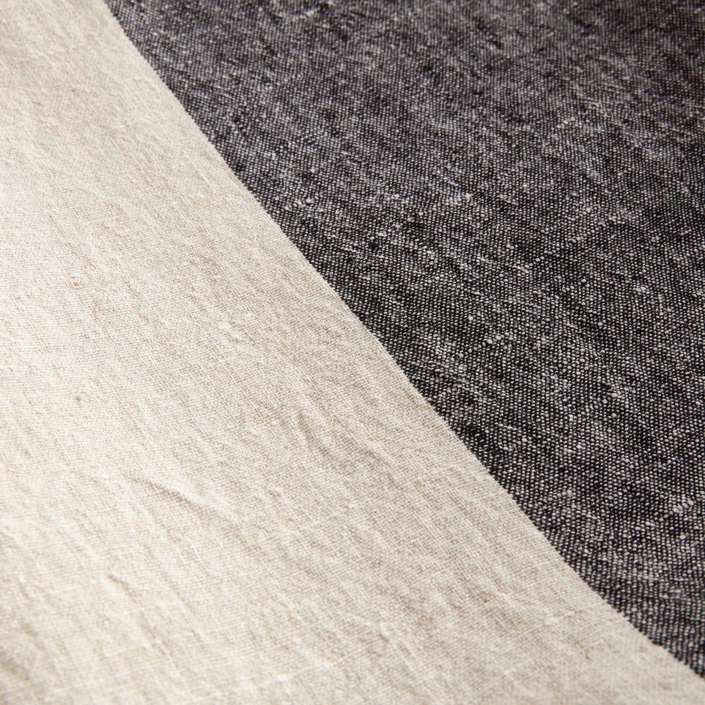 Lightweight charcoal & ivory linen woven throw for home decor and accessories.