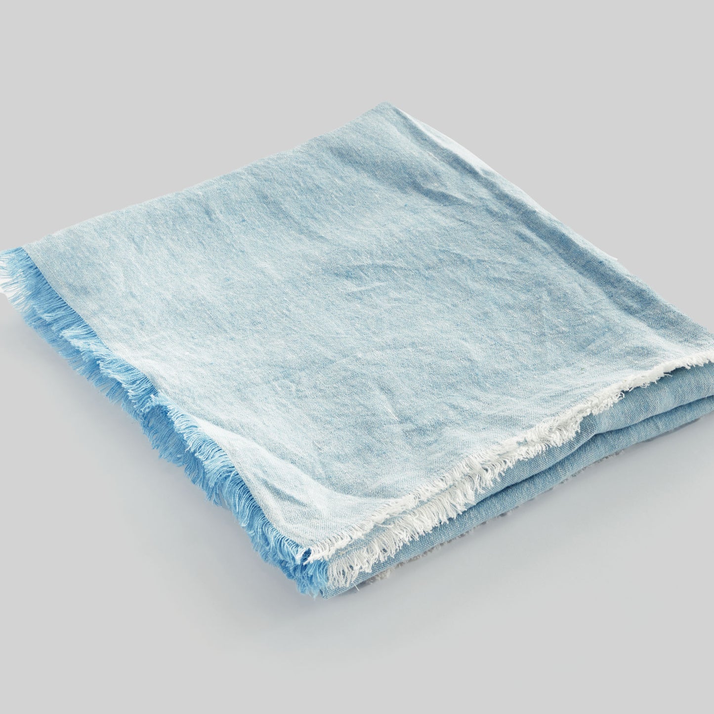 Lightweight light blue linen woven throw for home decor and accessories.