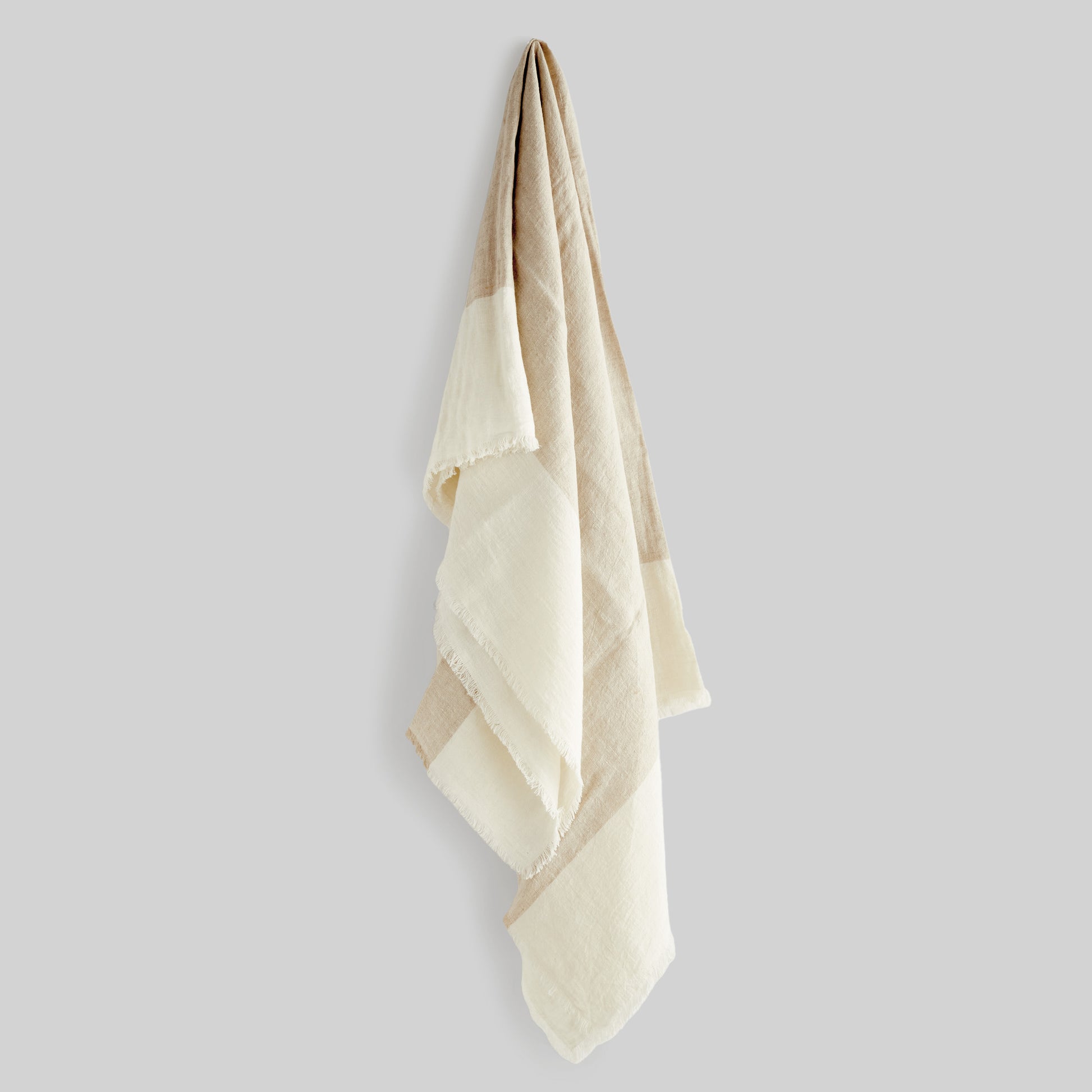 Lightweight tan & ivory linen woven throw for home decor and accessories.