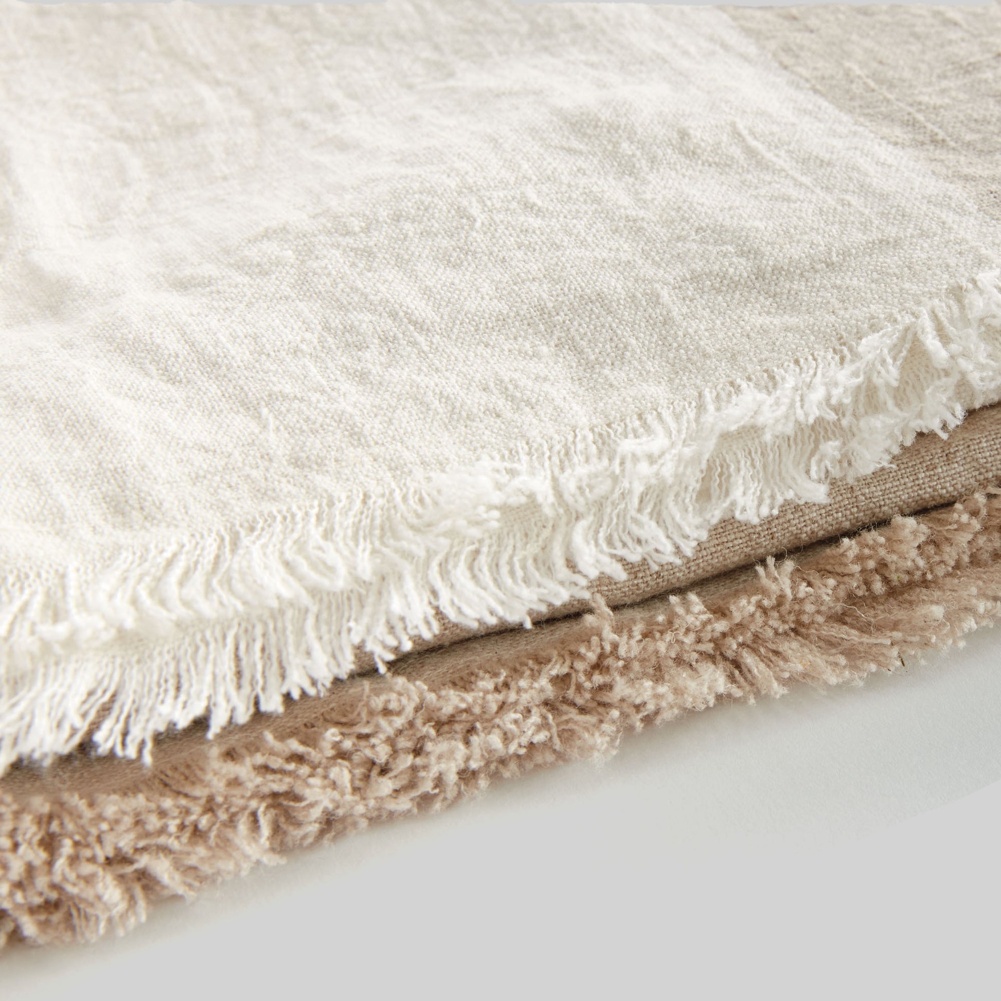 Lightweight tan & ivory linen woven throw for home decor and accessories.