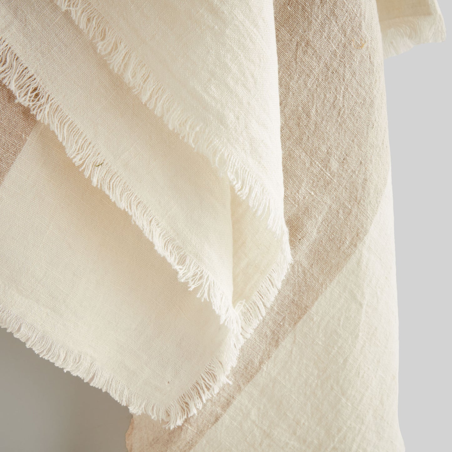 Lightweight tan & ivory linen woven throw for home decor and accessories.