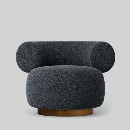 Gray textured fabric armchair on a light gray background.