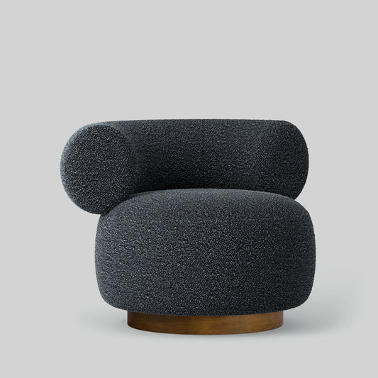 Gray textured fabric armchair on a light gray background.