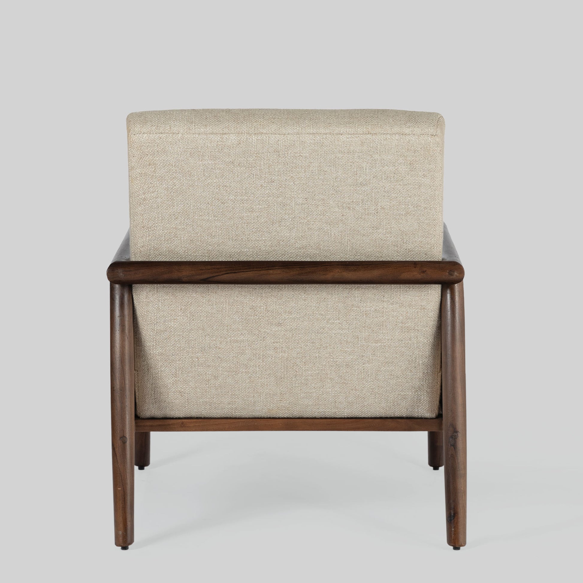 Beige armchair with cane arms and wooden frame on a light gray background.