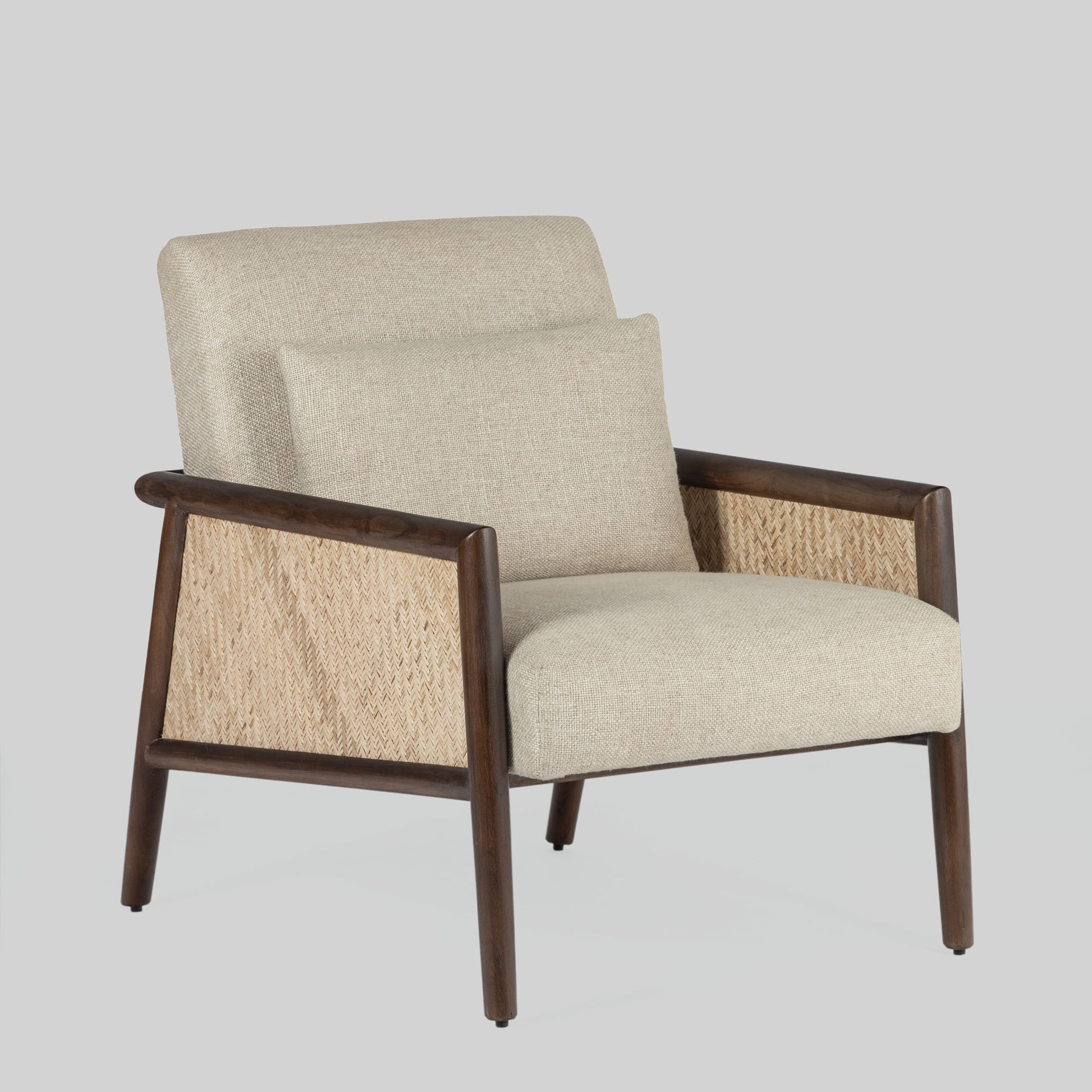 Beige armchair with cane arms and wooden frame on a light gray background.