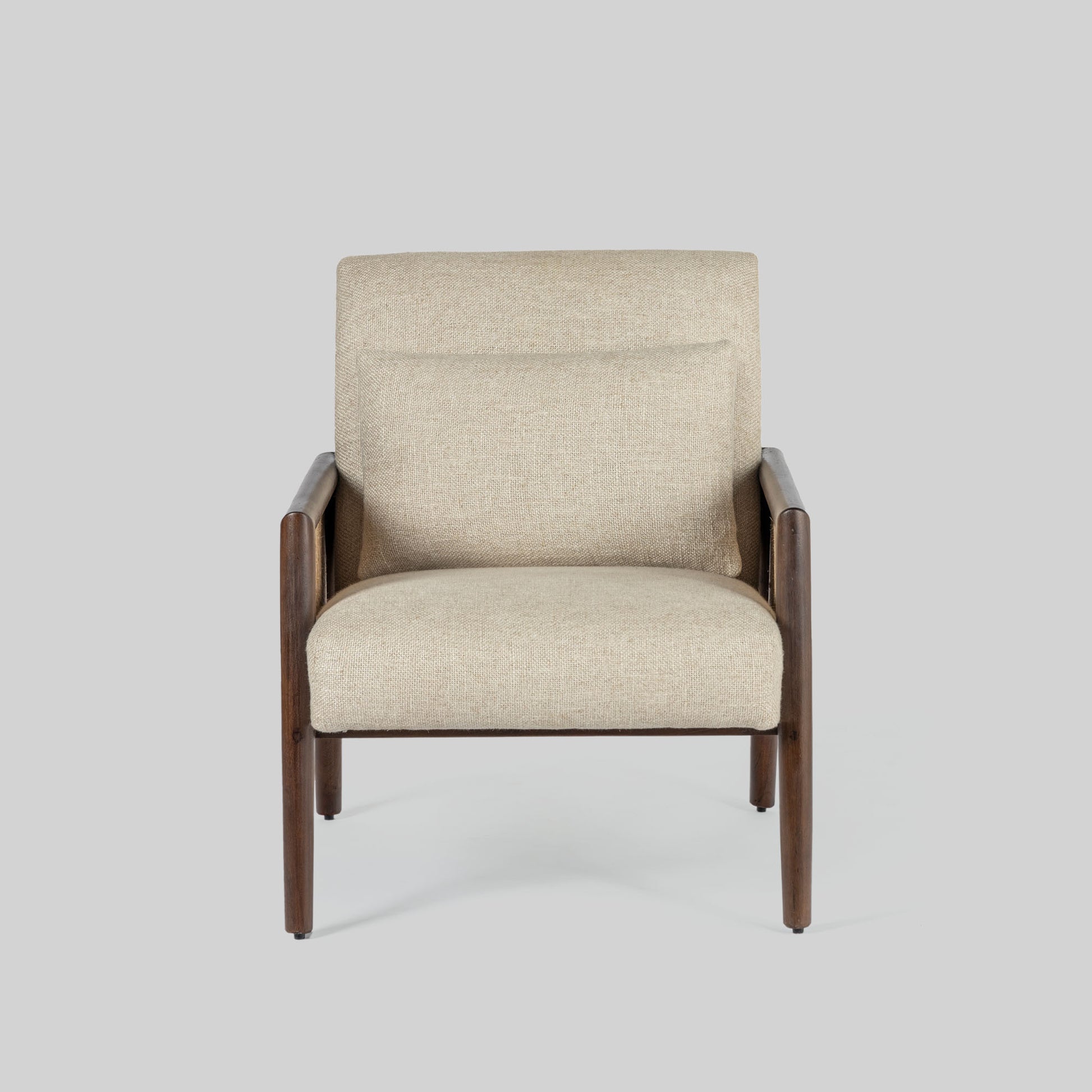 Beige armchair with cane arms and wooden frame on a light gray background.