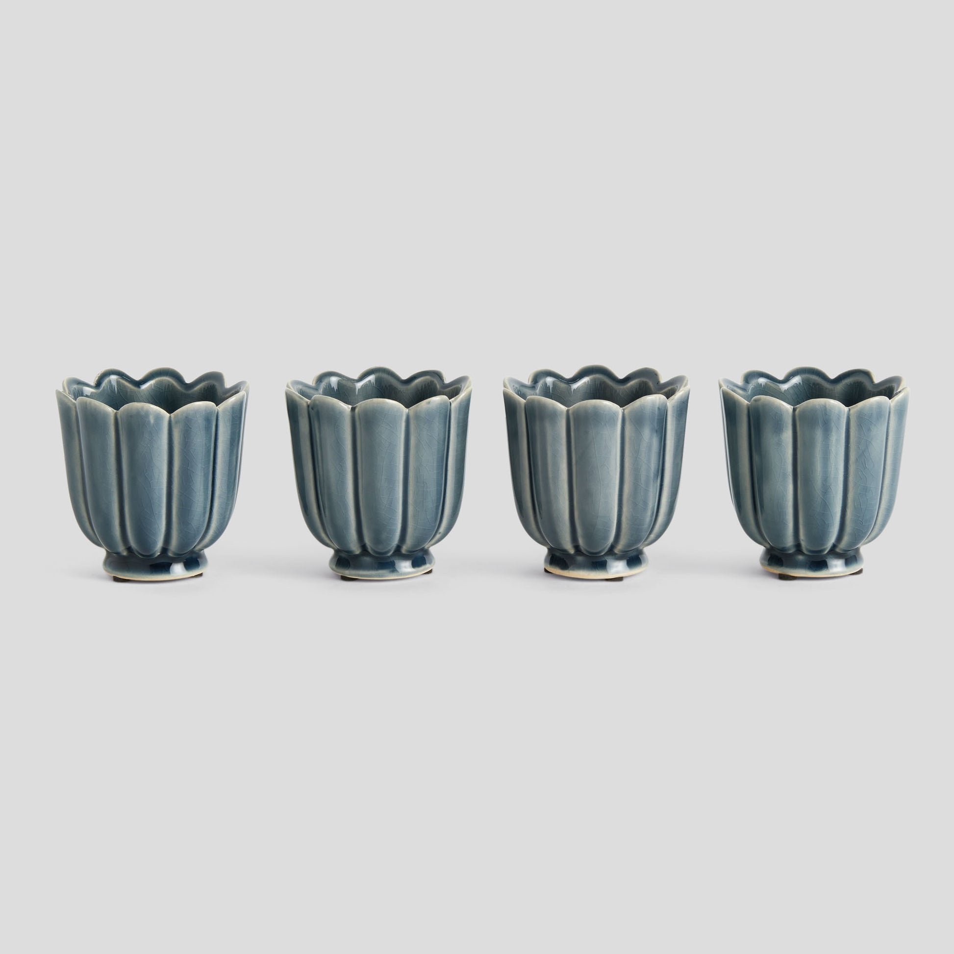 Mini teal reactive glaze ceramic pots (set of 4) - stylish home accent (Image1).