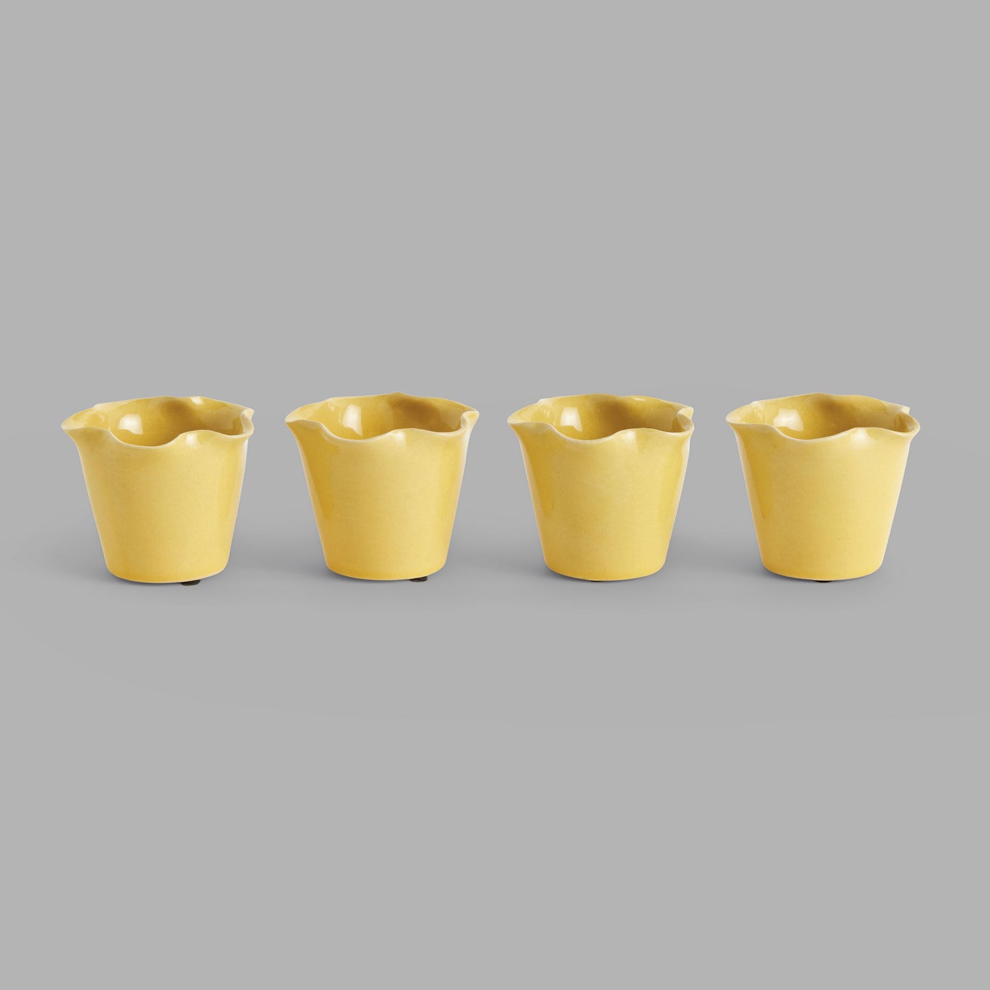 Mini yellow reactive glaze ceramic pots (set of 4) - stylish home accent (Image1).