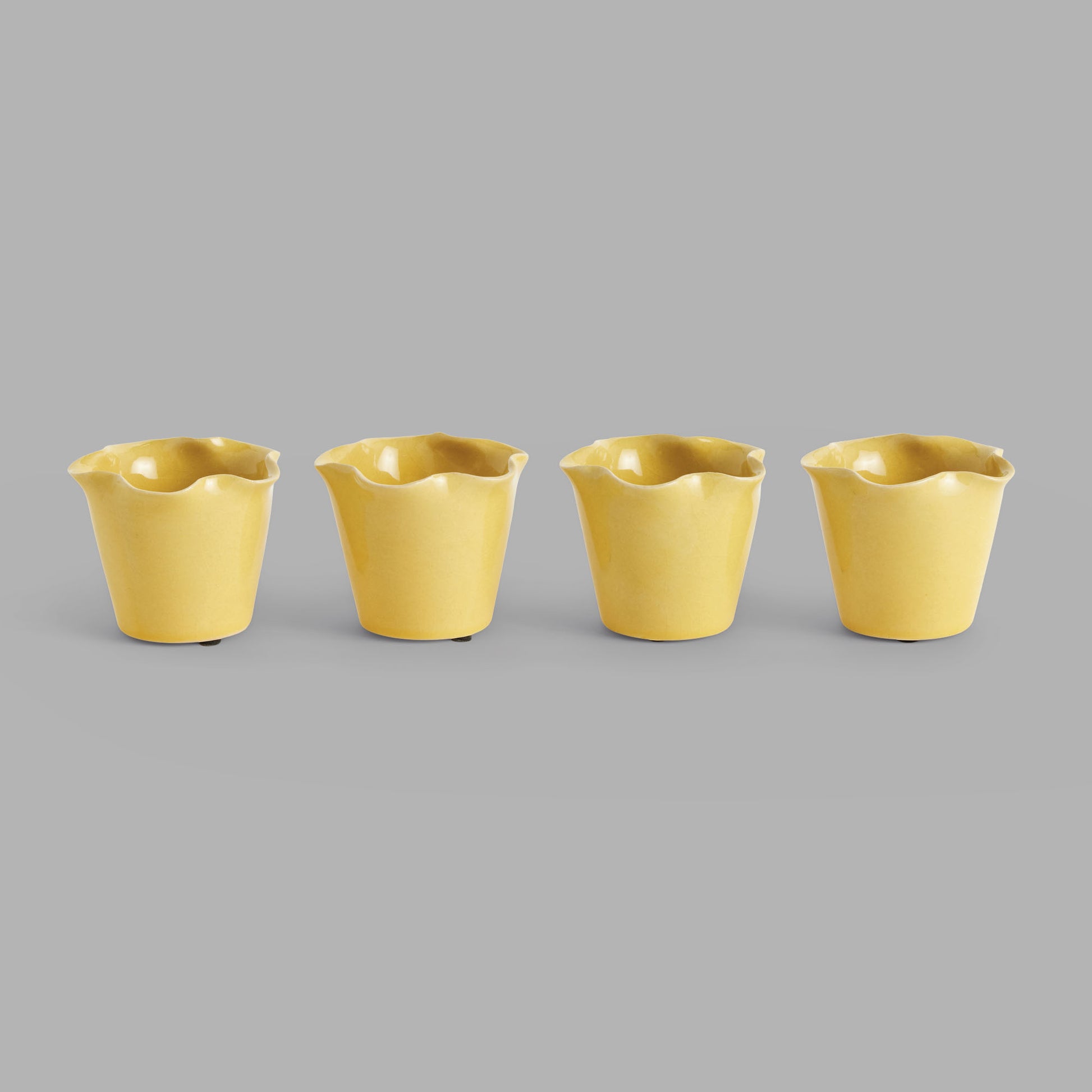 Mini yellow reactive glaze ceramic pots (set of 4) - stylish home accent (Image1).