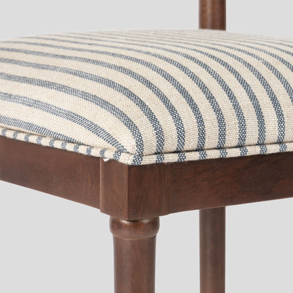 Wooden chair with a striped cushion on a white background