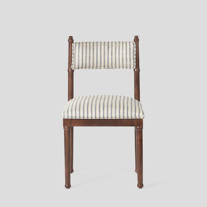 Chair with striped cushion on a light gray background