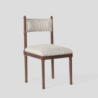 Chair with striped cushion on a light gray background