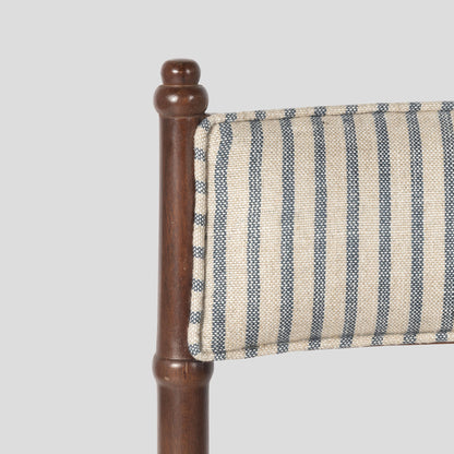 Chair with wooden frame and striped fabric seat on a gray background