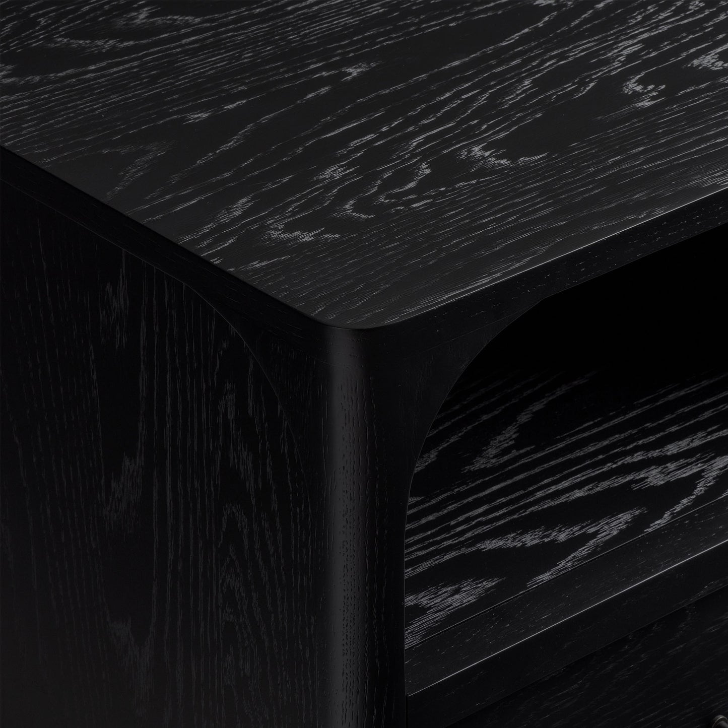 Close-up of black oak nightstand with visible grain texture