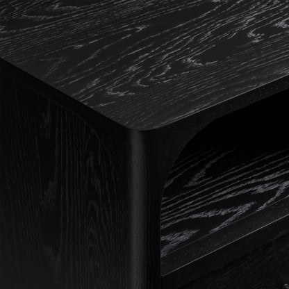 Close-up of black oak nightstand with visible grain texture