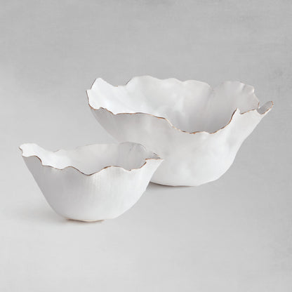 Organic decorative ceramic bowl set with gray background.