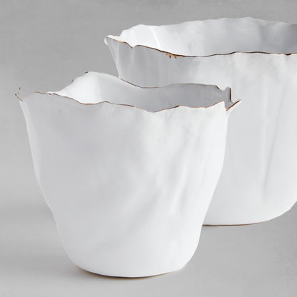 Organic white ceramic cachepots, set of two, front view, with gray background.