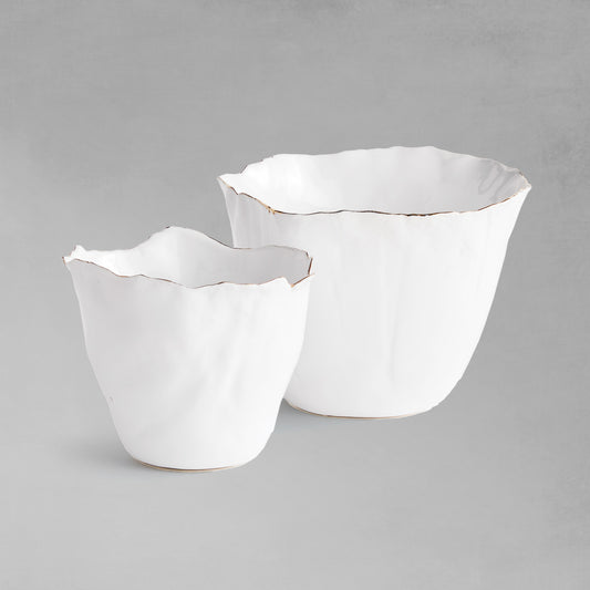 Organic white ceramic cachepots, set of two, with gray background.