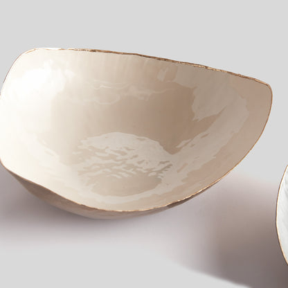 Painted catchall bowl with beige finish.