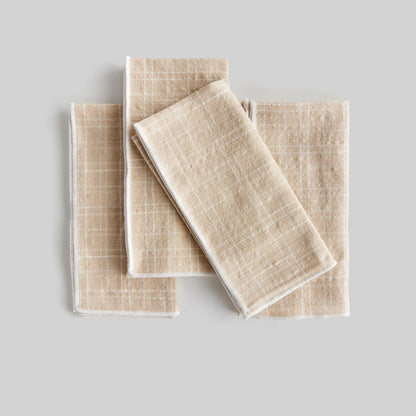 Plaid square cotton dinner napkins set of 4 with gray background.