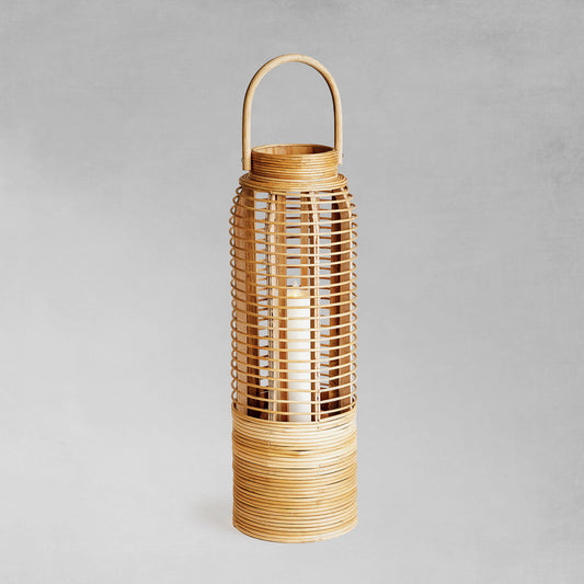 Rattan cylinder small lantern with gray background.