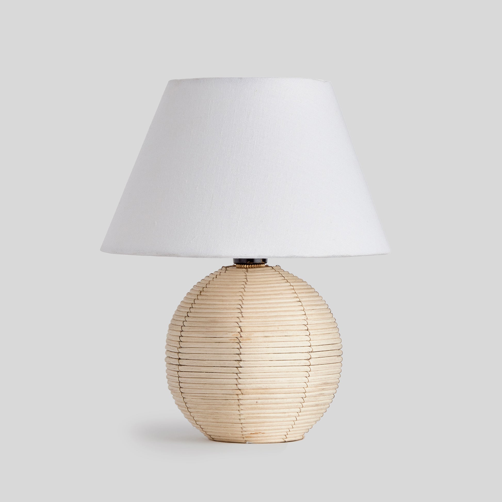 Rattan mini lamp with gray background.