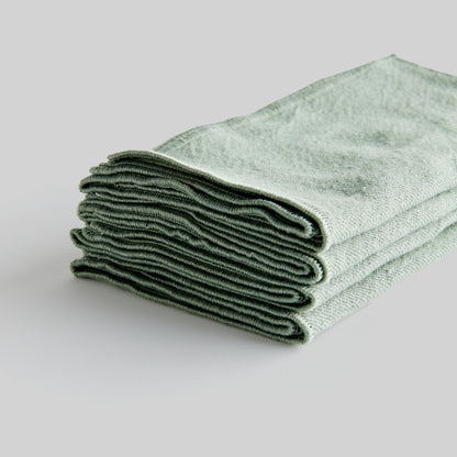 Sage green square cotton dinner napkins set of 4, closeup view of edge detailing.