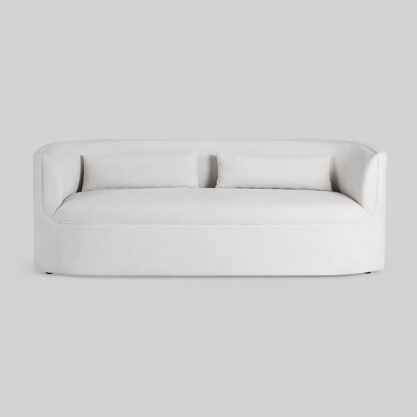 Light dove colored fabric sofa on gray background.