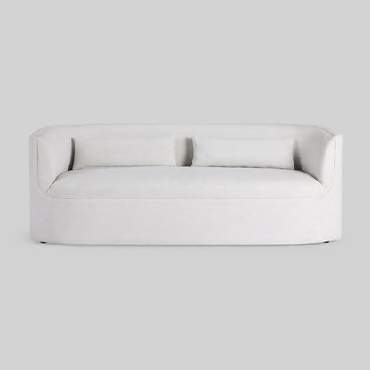 Light dove colored fabric sofa on gray background.