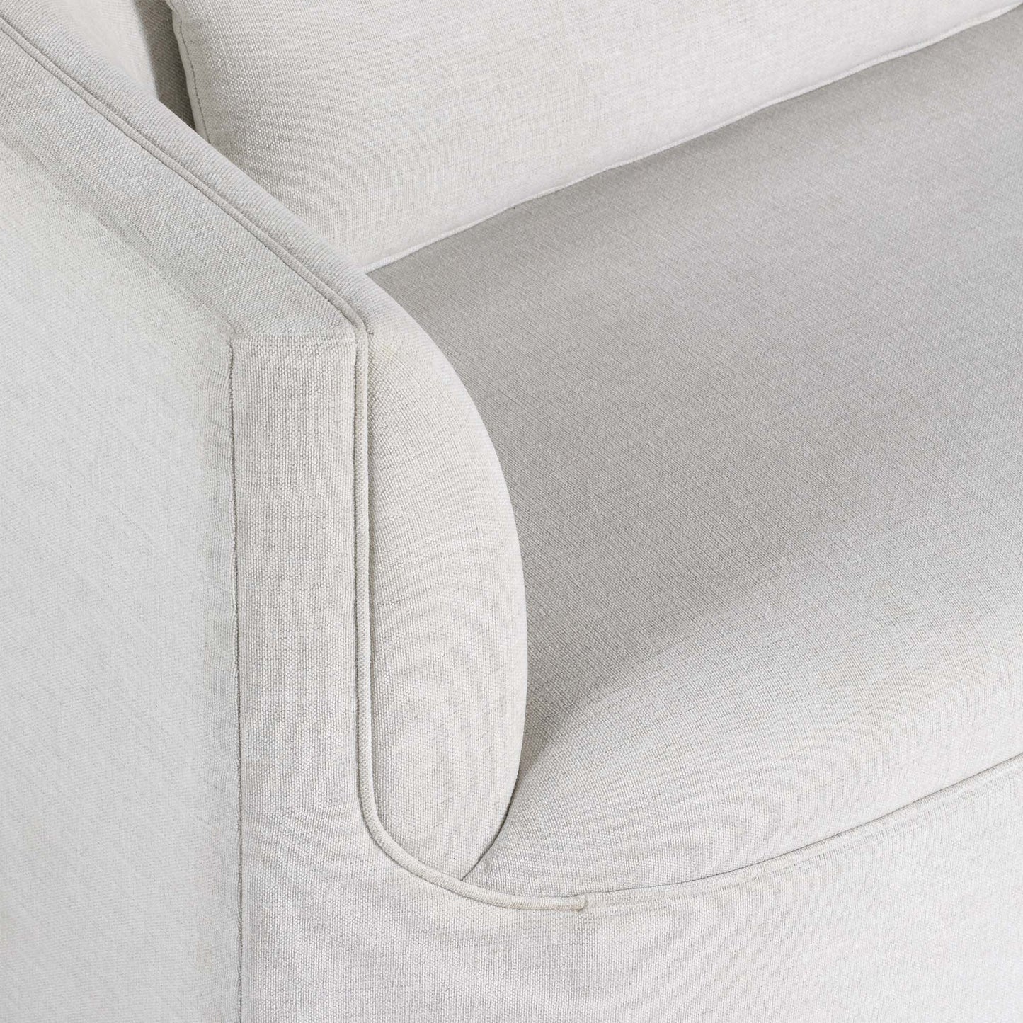 Light dove colored fabric sofa on gray background.