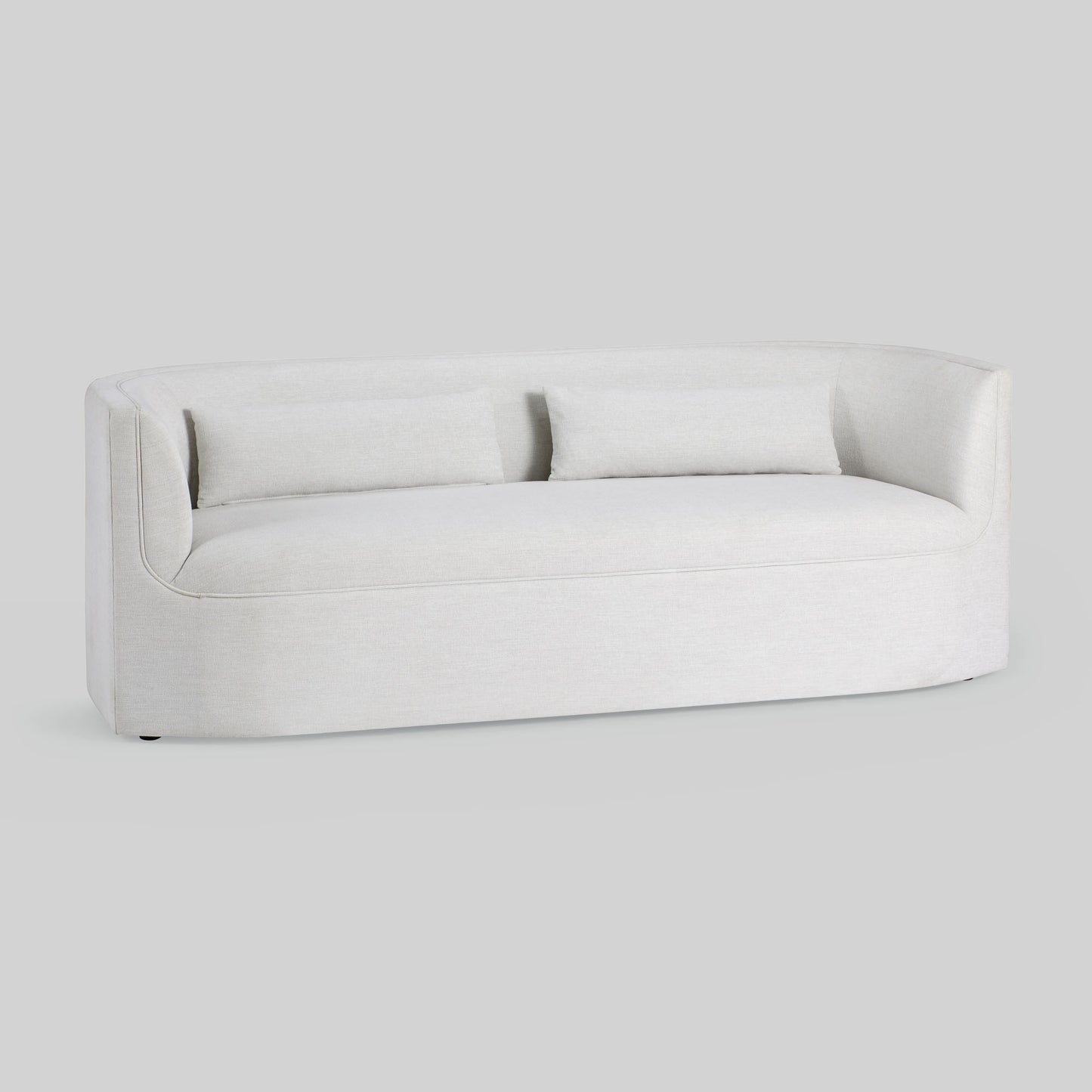 Light dove colored fabric sofa on gray background.
