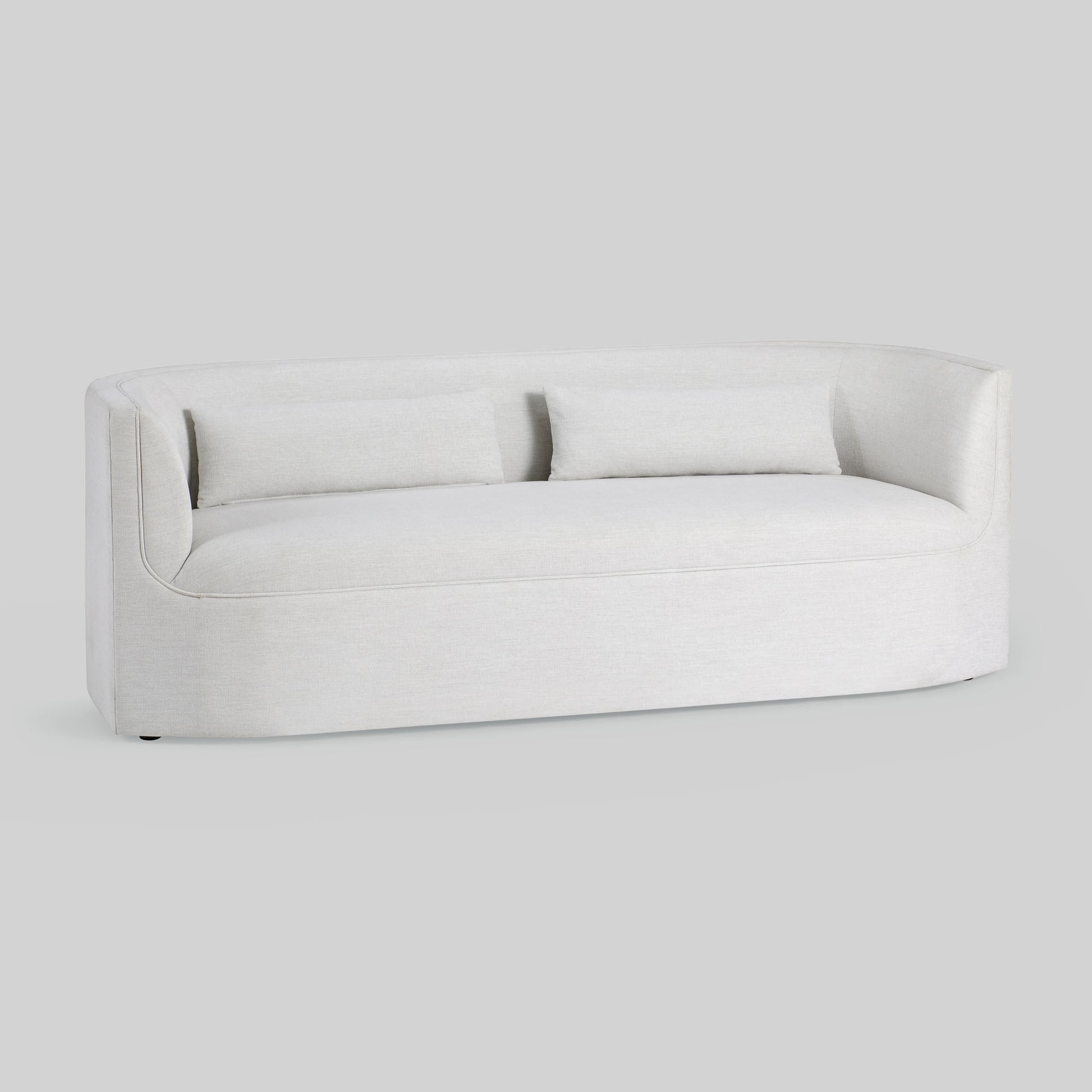 Light dove colored fabric sofa on gray background.
