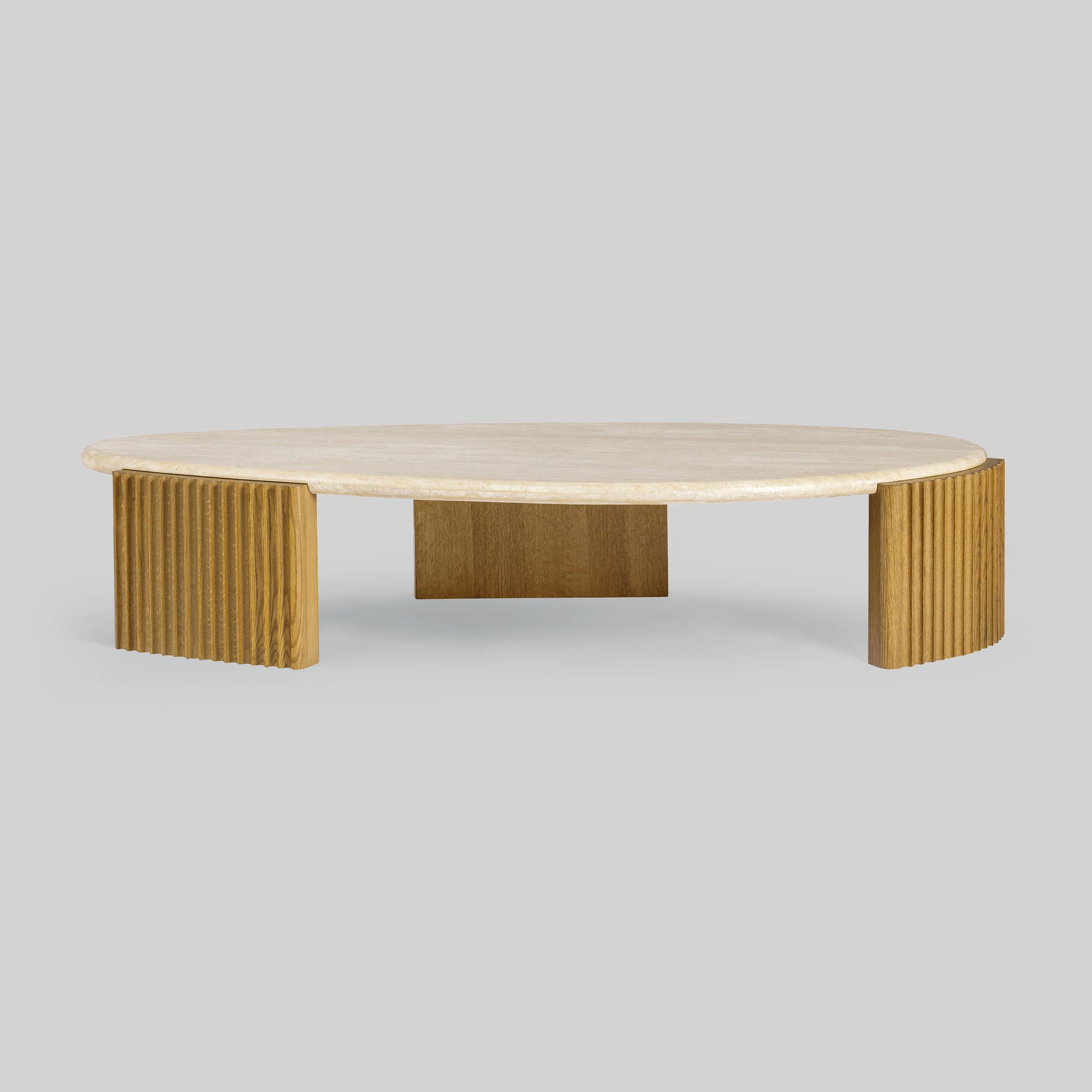 Contemporary light oak coffee table with marble top and wooden fluted base on a gray background.