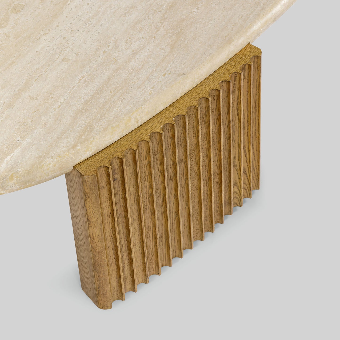 Contemporary light oak coffee table with marble top and wooden fluted base on a gray background.