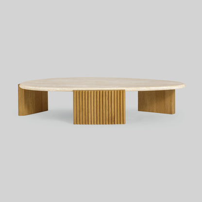 Contemporary light oak coffee table with marble top and wooden fluted base on a gray background.
