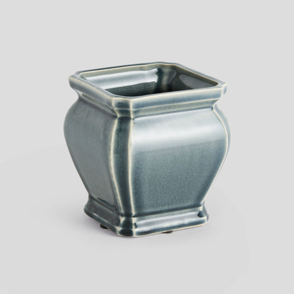 Small blue reactive glaze ceramic pot - stylish home accent (Image1).