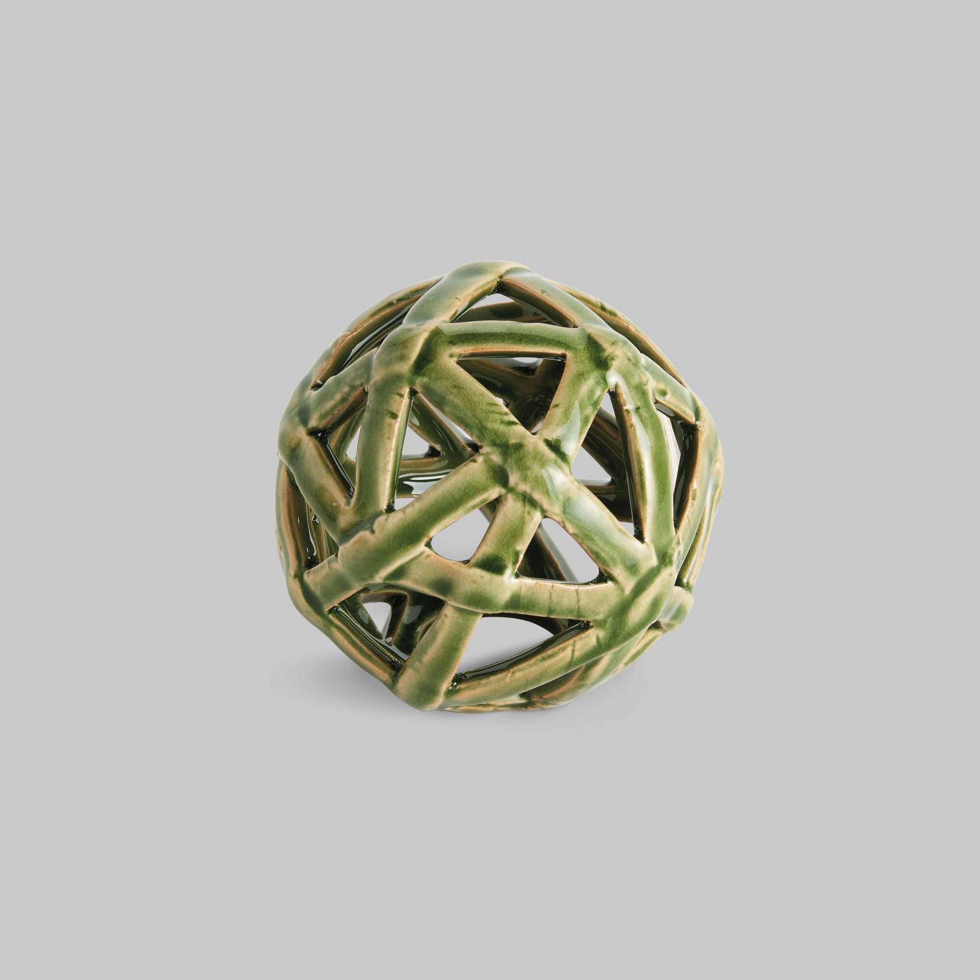 Small green reactive glaze ceramic orb - stylish home accent (Image1).