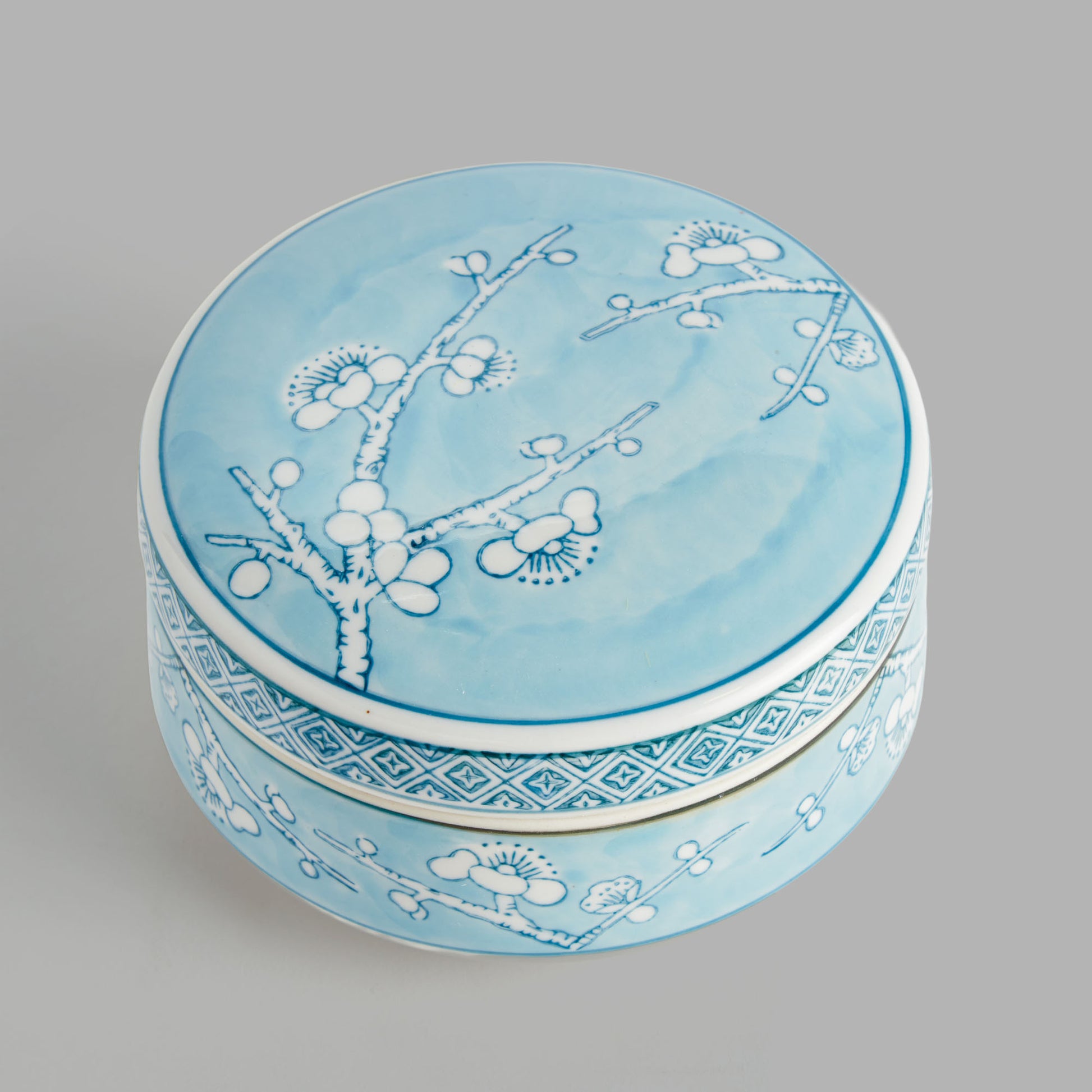 Small round light blue hand-painted porcelain lidded box - stylish home accent (Image5).