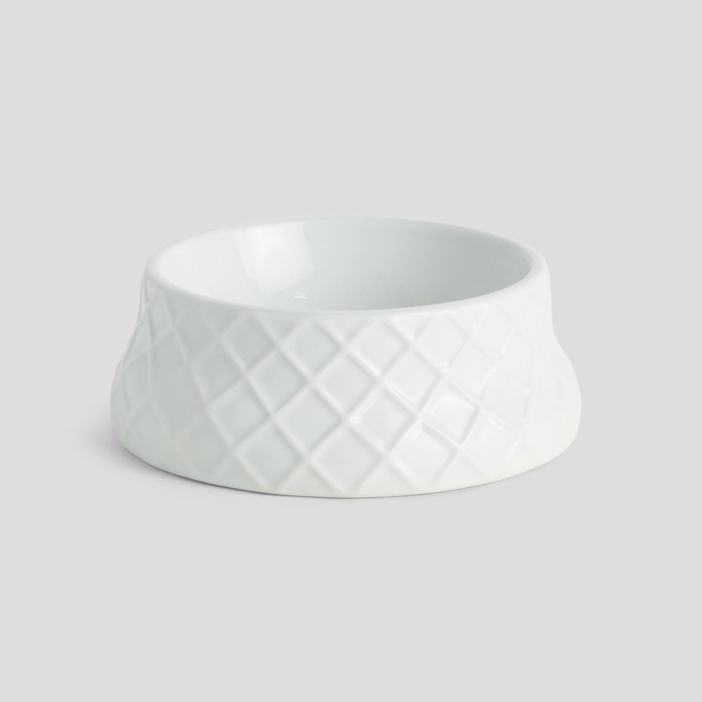 Small white handcrafted porcelain trellis pet bowl - stylish home accent (Image1).